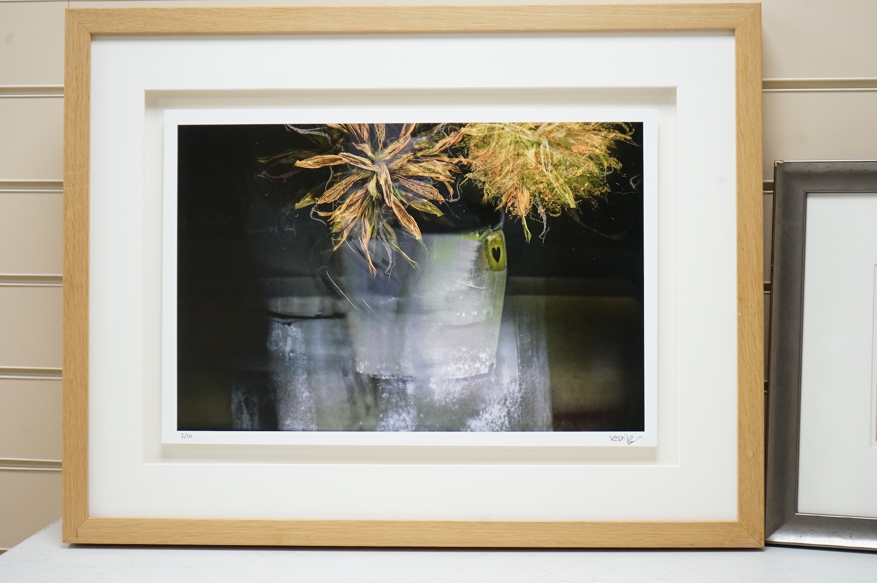 Valda Bailey (contemporary), Still life’s of fruit and flowers, one titled ‘Rainbow’, the other signed and numbered in ink, two photographic prints, largest 32 x 47cm